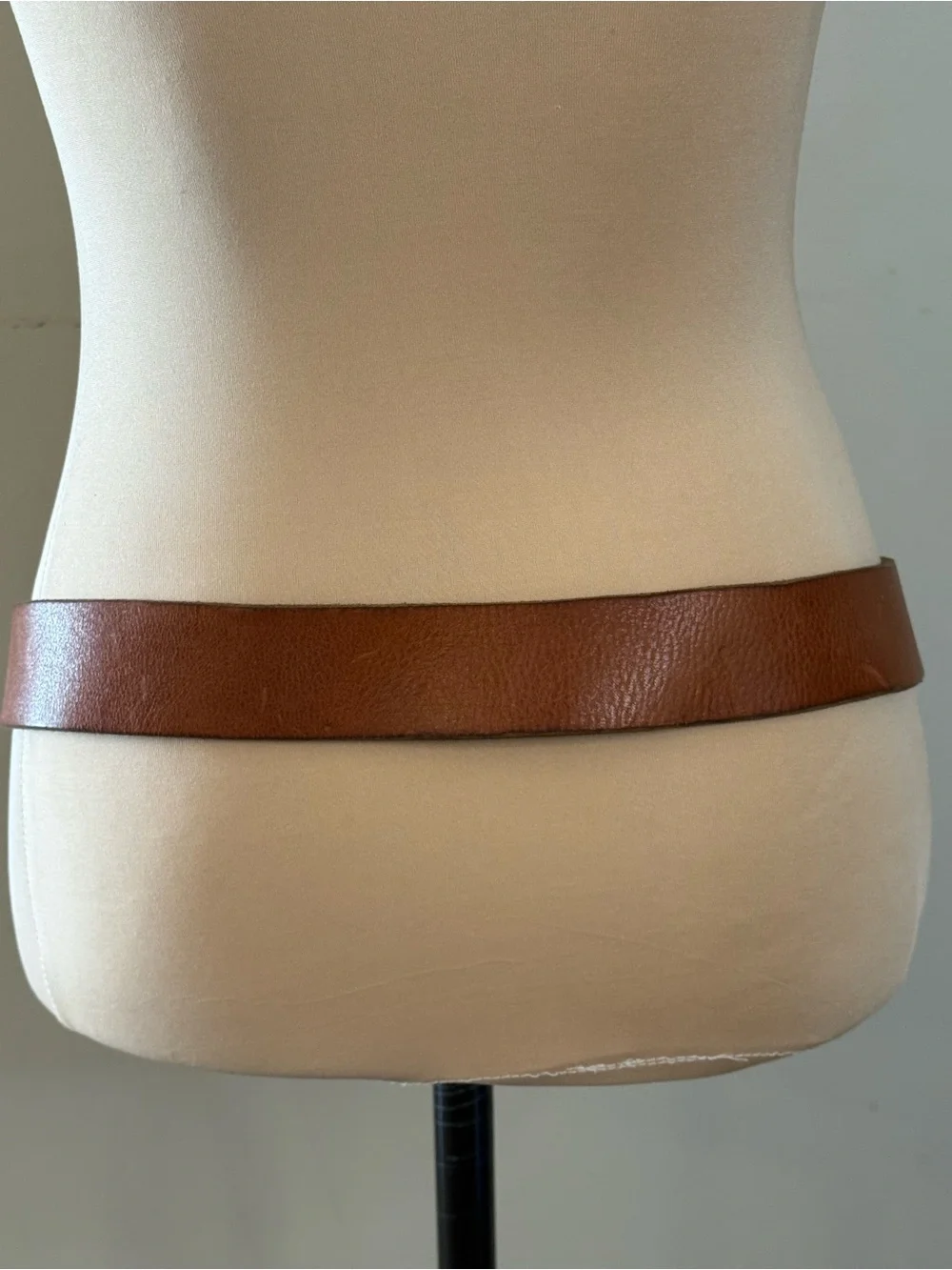 Eagle embroidered bold buckle on a light brown leather belt 44”